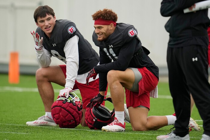(Marcio Jose Sanchez | AP) Utah safeties Cole Bishop, left, and R.J. Hubert (11) kneel during practice ahead of the Rose Bowl NCAA college football game against Penn State, Friday, Dec. 30, 2022, in Carson, Calif.