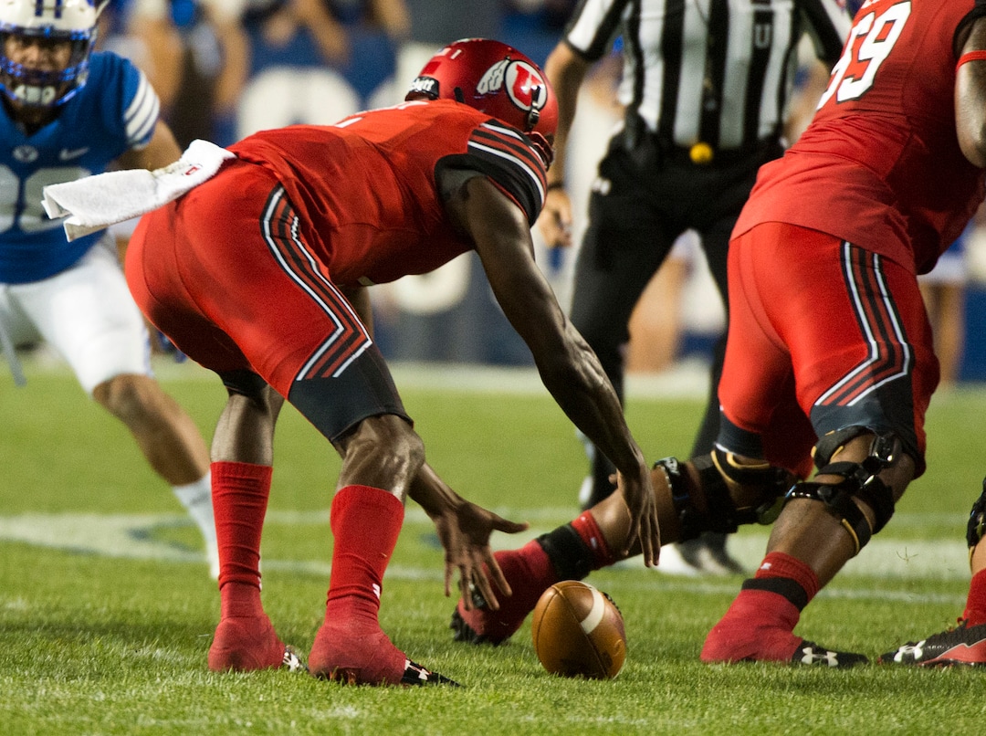 (Rick Egan  |  The Salt Lake Tribune)  Utah Utes quarterback Tyler Huntley (1) drops the ball, but recovers the fumble, in football action BYU vs Utah, at Lavell Edwards Stadium in Provo, Saturday, September 9, 2017.