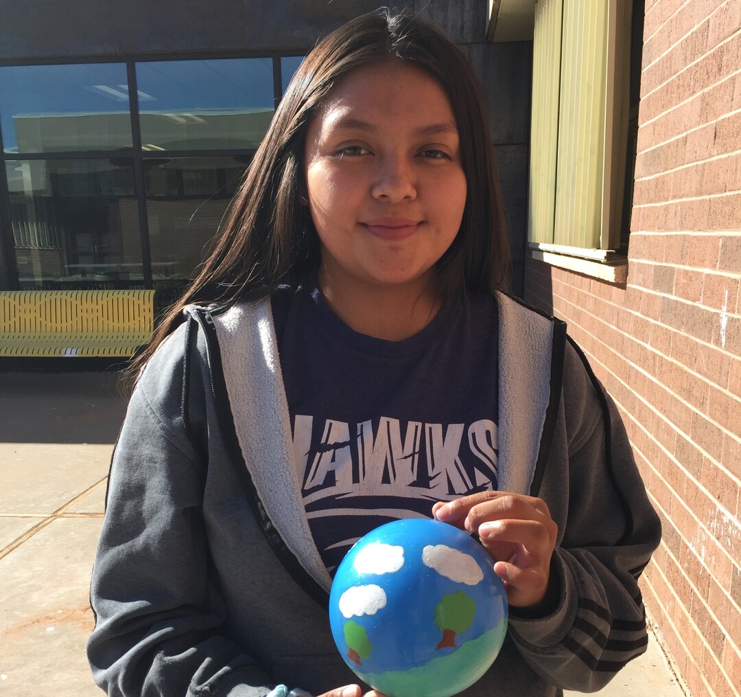 (Photo courtesy of Georgiana Simpson) A student at Whitehorse High School holds an ornament she painted.