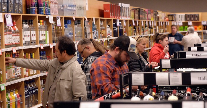 (Al Hartmann  |  The Salt Lake Tribune) 	Shoppers fill the ailes at the Cottonwood Heights state liquor store Wednesday Nov. 22.  The Wednesday before Thanksgiving is typically one of the busiest days for liquor sales in Utah. Customers typically line up outside before the 11 a.m. opening.   Extra employees work to handle the holiday rush. 