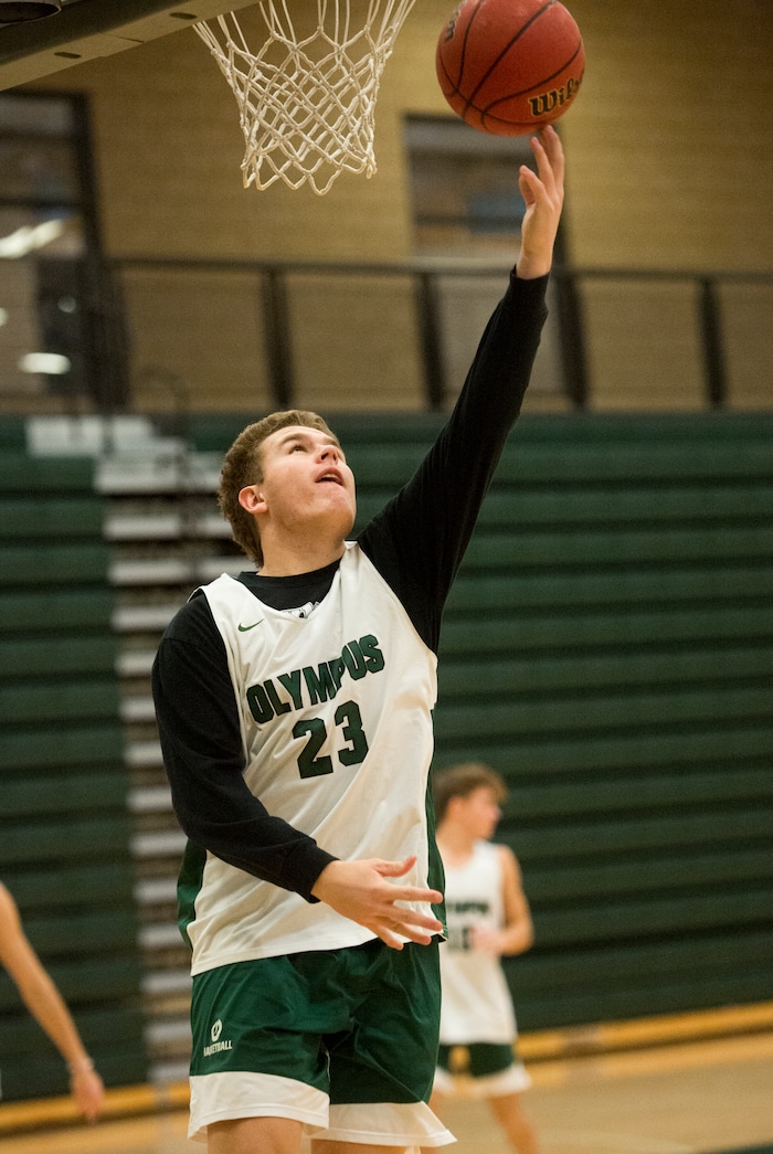 (Rick Egan  |  The Salt Lake Tribune)    Harrison Creer (23), one of Olympus boys' basketball team's two big men runs drills during basketball practice, Monday, January 8, 2018.