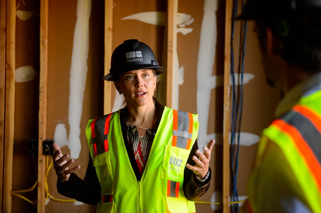 (Trent Nelson  |  The Salt Lake Tribune)  Salt Lake City Councilwoman and mayoral candidate Erin Mendenhall tours the Project Open 2 housing project in Salt Lake City on Wednesday Sept. 25, 2019. At right is Chris Parker of Giv Development.