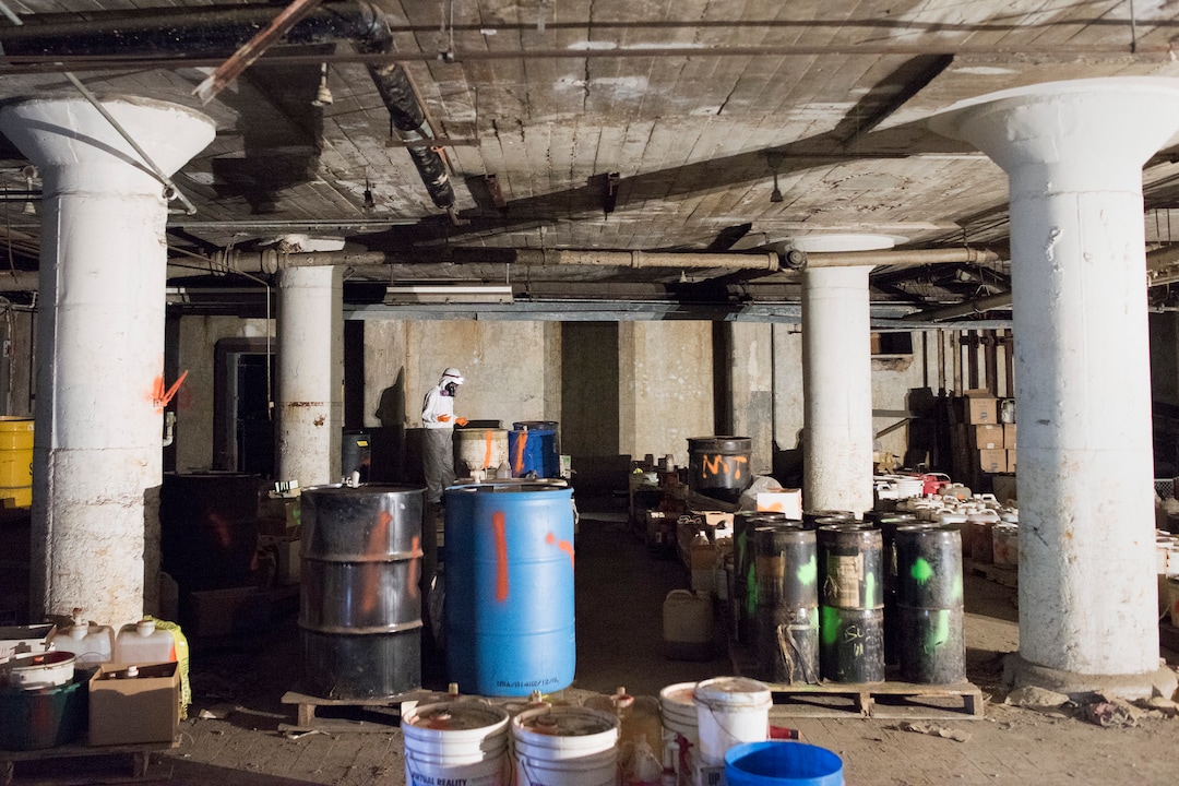 (Briana Scroggins  |  The Utah Investigative Journalism Project) EPA Contractor Kim Roberts sorts out drums before the drums are moved to a staging location at the Swift building in Ogden on Thursday, May 16, 2019. The EPA started site clean up on April 1 and plan to finish by August 2019. Some of the 40,000 containers staged thus far have contained flammable liquids, oil, tar and acids. EPA On-scene Coordinator Paul Peronard said that he expects the total number of containers to reach about 60,000.