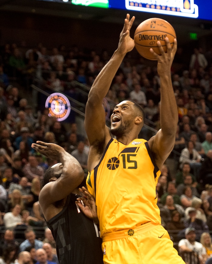 (Rick Egan  |  The Salt Lake Tribune)Utah Jazz forward Derrick Favors (15) takes the ball to the hoop, as Houston Rockets guard James Harden (13) defends, in NBA action, Utah Jazz vs Houston Rockets in Salt Lake City, Thursday, December 7, 2017.


