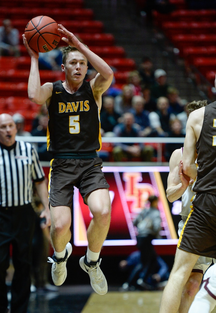(Francisco Kjolseth  |  The Salt Lake Tribune)  Davis vs Lone Peak, 6A State high school basketball tournament at the Huntsman Center in Salt Lake City, Thursday March 1, 2018. Josh Sanders (5) tries to get rid of the ball against Lone Peak. 
