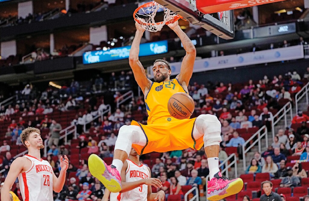 Utah Jazz's Rudy Gobert dunks the ball against the Houston Rockets during the second half of an NBA basketball game Wednesday, March 2, 2022, in Houston. The Jazz won 132-127 in overtime. (AP Photo/David J. Phillip)