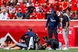 (Trent Nelson | The Salt Lake Tribune) Utah State Aggies head coach Bronco Mendenhall and Utah Utes head coach Morgan Scalley look down at an injured Utah State Aggies linebacker, Harrison Taggart (0), as Utah hosts Utah State, NCAA football in Salt Lake City on Thursday, Sept. 17, 2026.