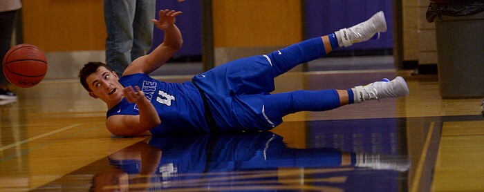 (Leah Hogsten  |  The Salt Lake Tribune) Dixie's Brody Henderson flies off the court while chasing the ball. Dixie High School defeated Cyprus High School boys' basketball team 59-52 during the Riverton Holiday Tournament in Riverton, December 28, 2017. 