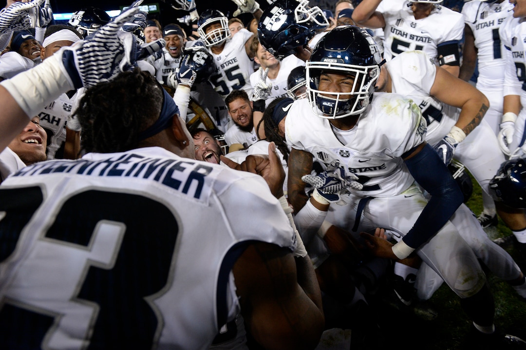 Leah Hogsten  |  The Salt Lake Tribune   Utah State Aggies celebrate the win after defeating BYU, 45-20, at Lavell Edwards Stadium in Provo, Friday, Oct. 5, 2018.