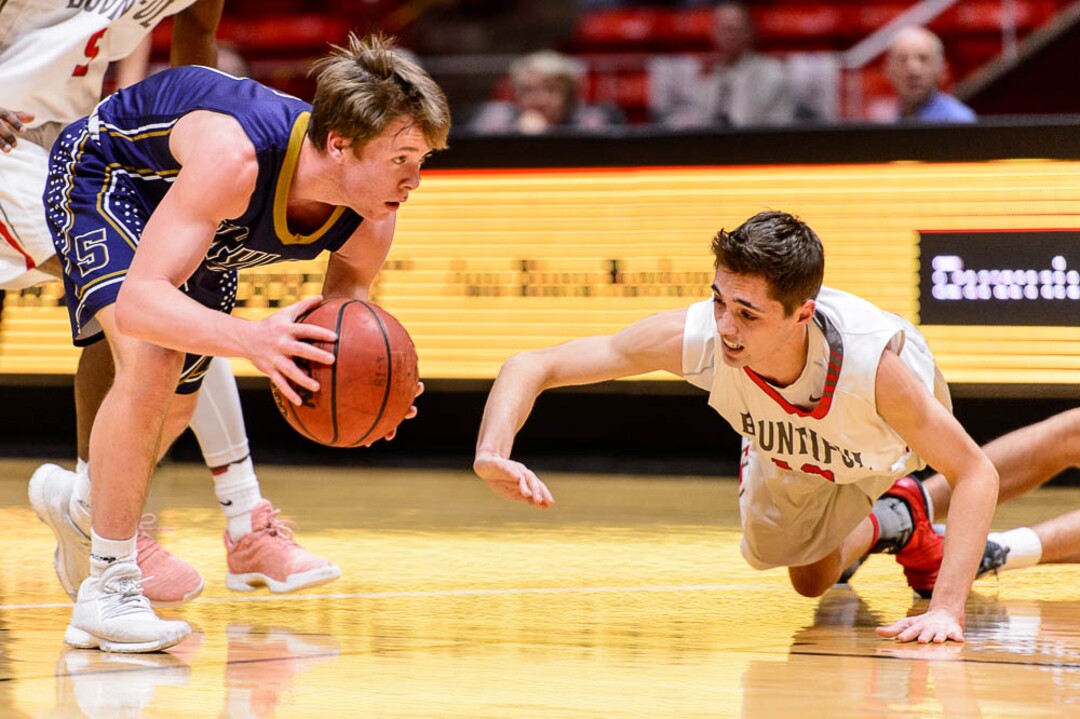 (Trent Nelson | The Salt Lake Tribune)  Skyline vs. Bountiful, 5A State high school basketball tournament at the Huntsman Center in Salt Lake City, Wednesday Feb. 28, 2018. Skyline's Adrian Wilde (4) and Bountiful's Jadon Chism (12).