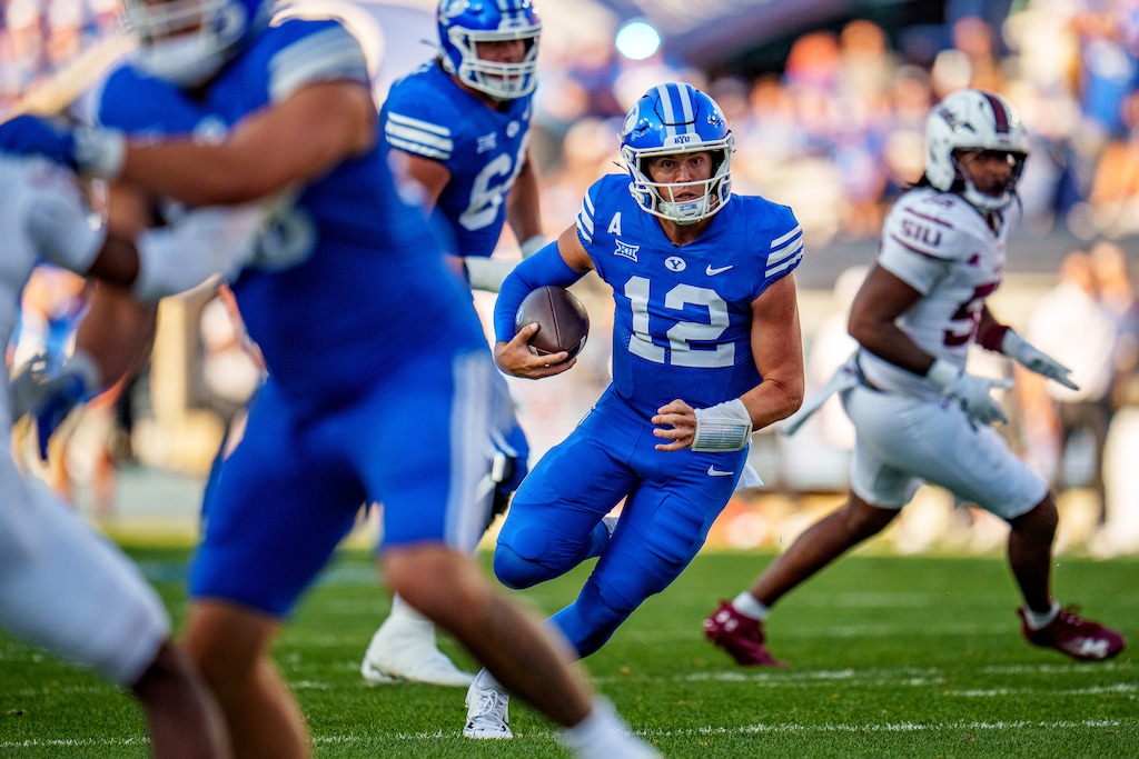(Trent Nelson  |  The Salt Lake Tribune) Brigham Young Cougars quarterback Jake Retzlaff (12) runs the ball as BYU hosts Southern Illinois, NCAA football in Provo on Saturday, Aug. 31, 2024.