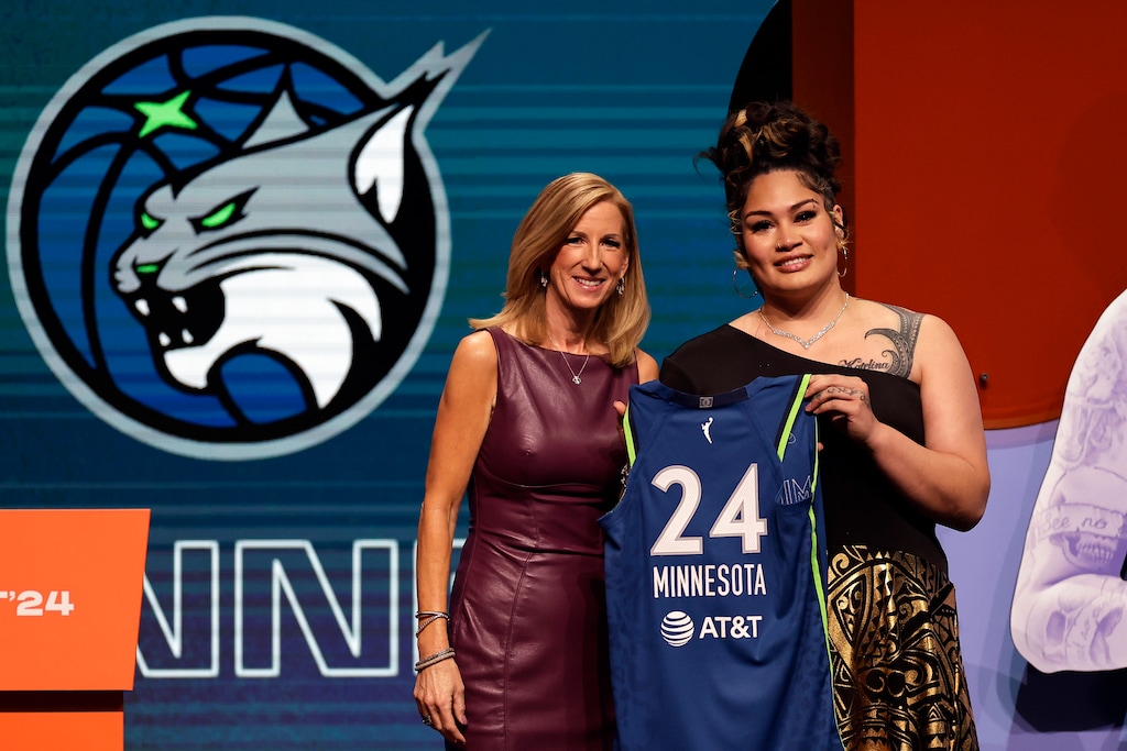 (Adam Hunger | AP) Utah's Alissa Pili, right, poses for a photo with WNBA commissioner Cathy Engelbert after being selected eighth overall by the Minnesota Lynx during the first round of the WNBA basketball draft on Monday, April 15, 2024, in New York.