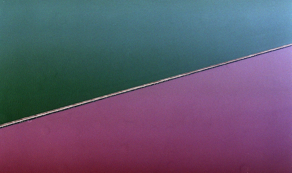 (Al Hartmann  |  Tribune file photo)  In this 1999 file photo, the Great Salt Lake undergoes a drastic change in color at the railway causeway.  South of the causeway the lake is a bluish green and north it turns a reddish color.