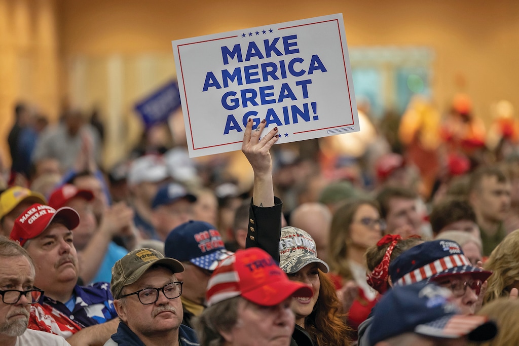 FILE - A Trump supporter holds up a MAGA sign during a rally for Donald Trump, in Green Bay, Wis., April 2, 2024. (AP Photo/Mike Roemer, File)