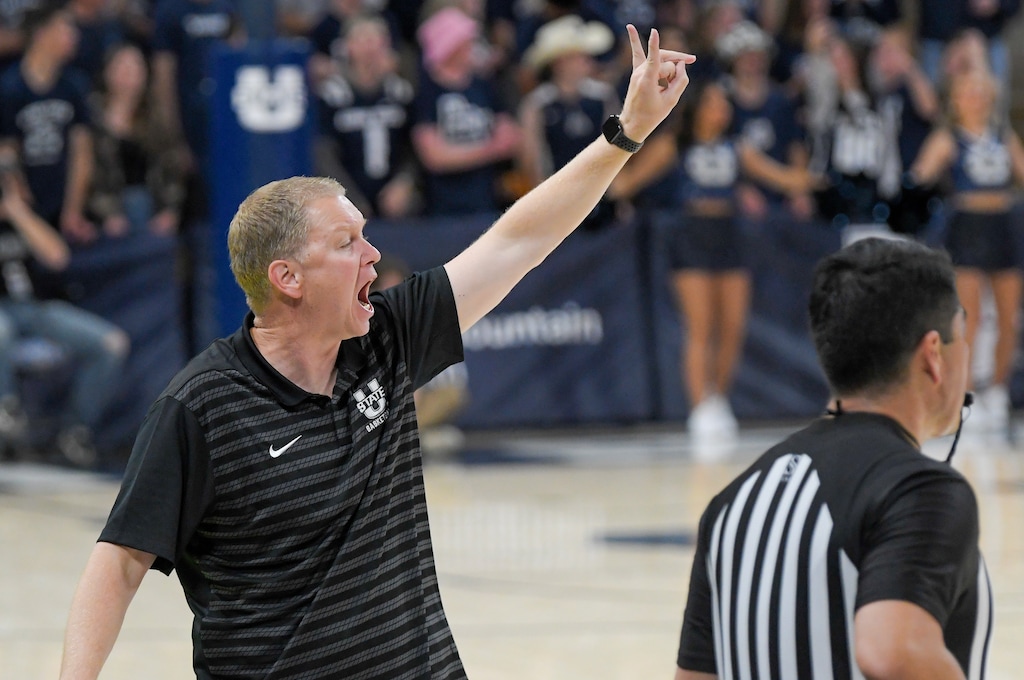 (Eli Lucero | The Herald Journal) Utah State head coach Jerrod Calhoun talks to players in the second half Friday in Logan.