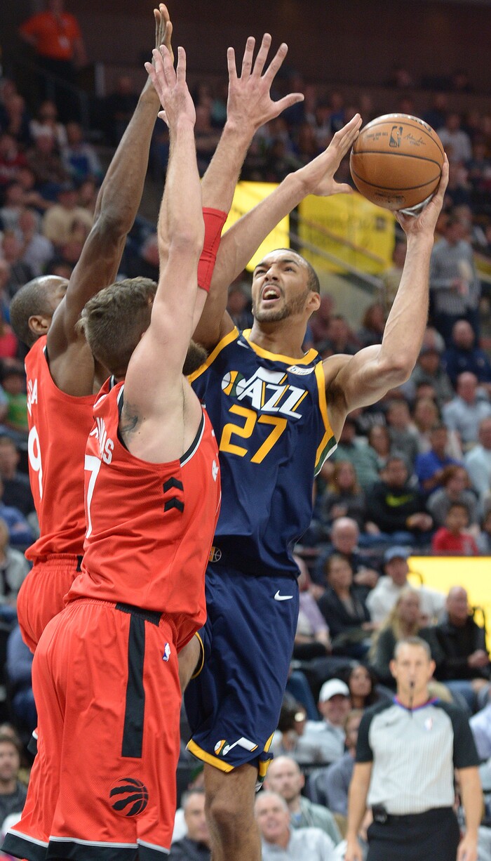 (Leah Hogsten  |  The Salt Lake Tribune) Utah Jazz center Rudy Gobert (27)battles Toronto Raptors center Jonas Valanciunas (17). The Utah Jazz lead the Toronto Raptors 54-53 at Vivint Smart Home Arena, Friday, November 3, 2017