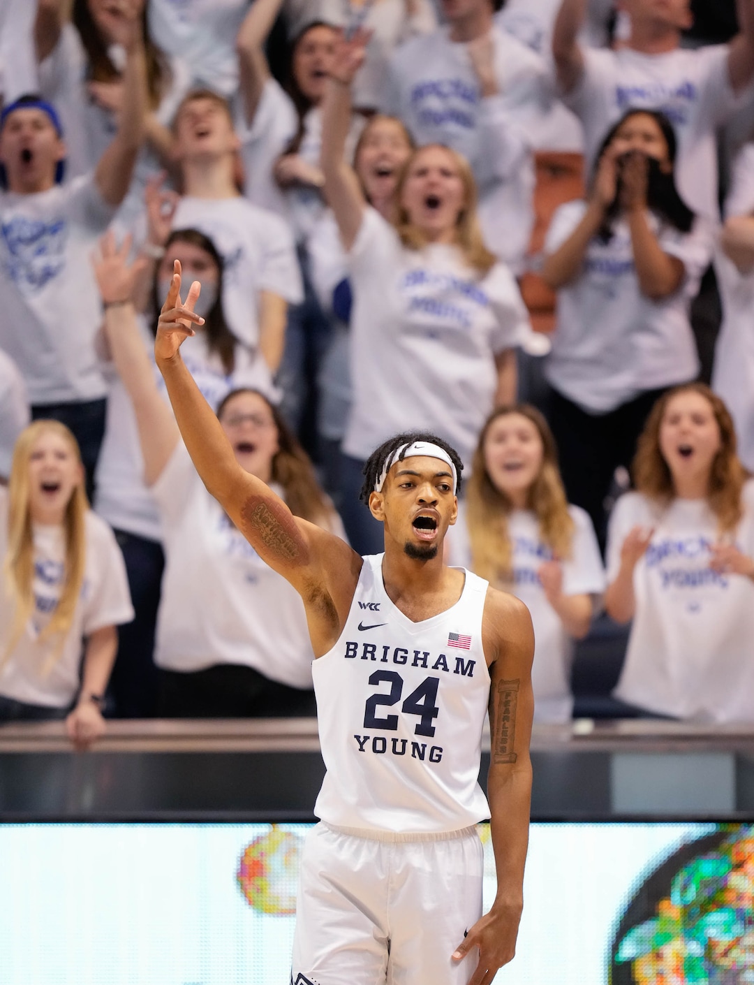 (Francisco Kjolseth | The Salt Lake Tribune) Brigham Young Cougars forward Seneca Knight (24) celebrates his three point shot in the final seconds of the first half of play in WCC basketball action between the Brigham Young Cougars and the Portland Pilots, at the Marriott Center, on Saturday, January 22, 2022.