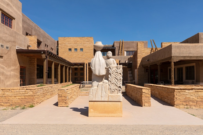 The Sky City Cultural Center, which includes the Haak’u museum that contains an extensive collection of Acoma pottery, in New Mexico on Aug. 22, 2019. In the red rock desert of the Southwest, an ancient culture was thought to have vanished but a new view connects it to pueblo dwellers of today. (John Burcham/The New York Times)