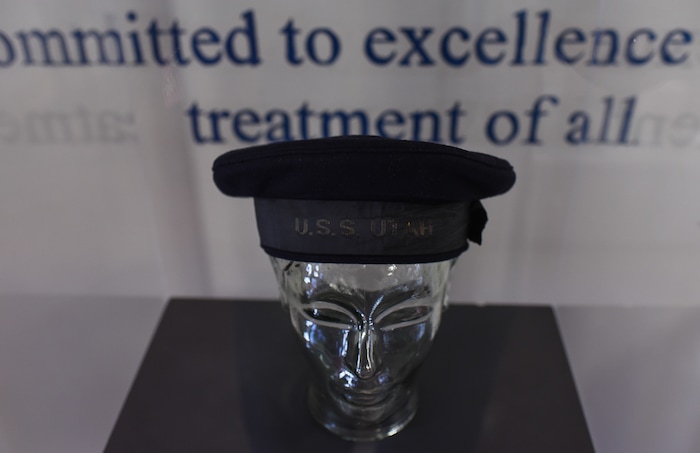 (Francisco Kjolseth  |  The Salt Lake Tribune)  Items salvaged from the USS Utah, one of the first lost at Pearl Harbor on Dec. 7, 1941, are put on display alongside the bell at the Naval Science building at the University of Utah.