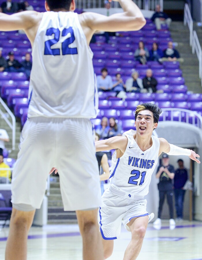 (Leah Hogsten  |  The Salt Lake Tribune) Pleasant Grove's Kawika Akina (21) runs to body slam teammate Pleasant Grove's Matt Van Komen (22) for Komen's dunk in the second half. Pleasant Grove defeated West Jordan 62-54 in the 6A High School Boys' Basketball Tournament opening game at Weber State University’s Dee Events Center in Ogden,  Tuesday, Feb. 27, 2018. 