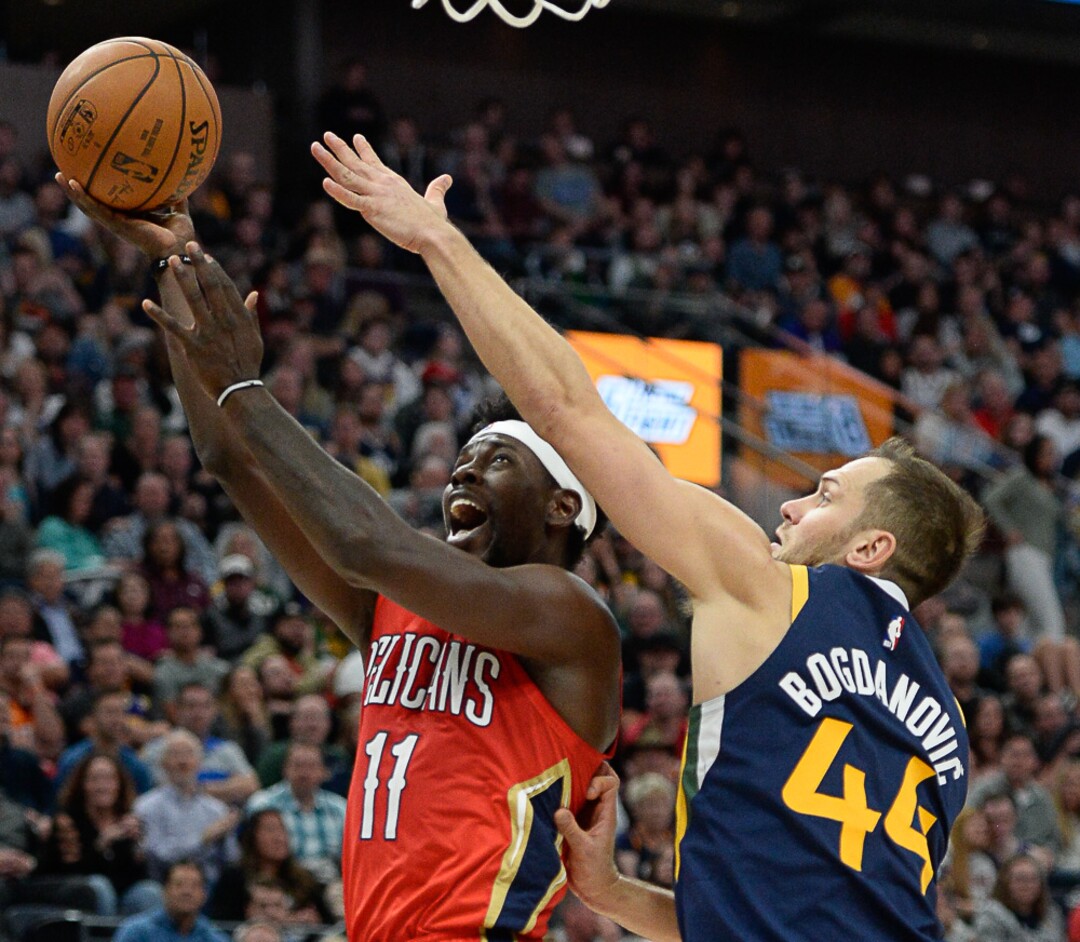 (Francisco Kjolseth  |  The Salt Lake Tribune)  New Orleans Pelicans guard Jrue Holiday (11) faces Utah Jazz forward Bojan Bogdanovic (44) as the Utah Jazz host the New Orleans Pelicans in their NBA basketball game at Vivint Smart Home Arena in Salt Lake City on Sat. Nov. 23, 2019.