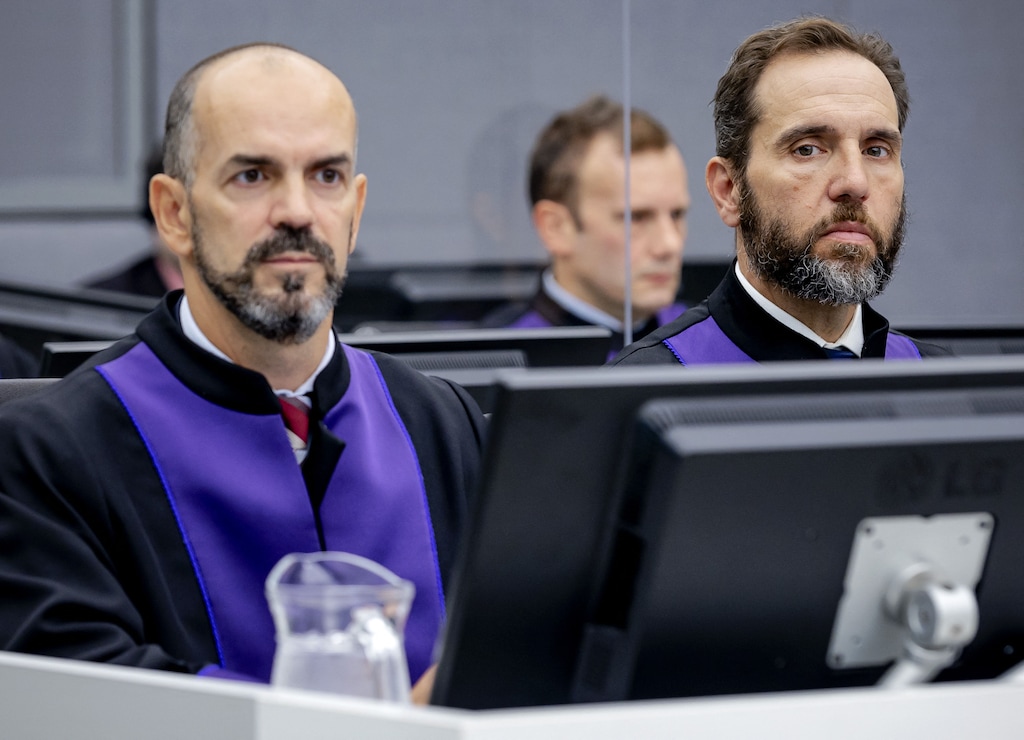 BC-OPINION-BASS-JACK-SMITH-TRUMP-ART-NYTSF — Prosecutor Jack Smith, right, at the Kosovo Specialist Chambers court in The Hague, at the start of the first trial of Salih Mustafa, former commander in the Kosovo Liberation Army in 2021. (Robin Van Lonkhuijsen for The New York Times)