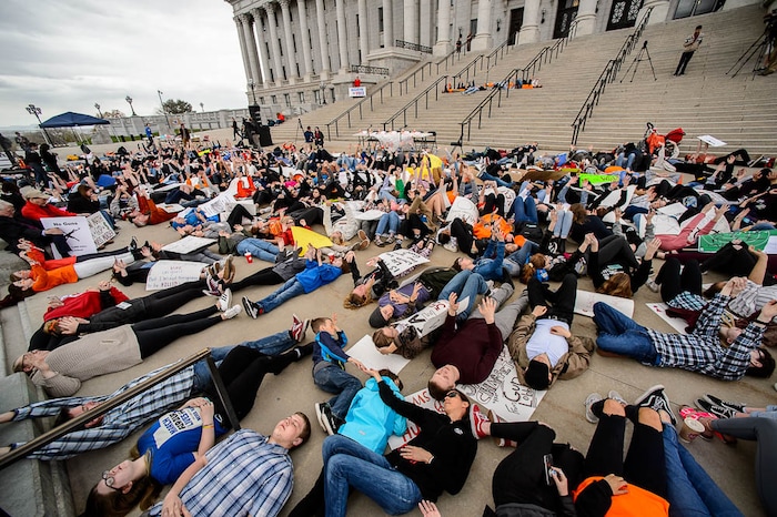 (Trent Nelson | The Salt Lake Tribune)  
High school students staged a die-in at the Utah State Capitol in Salt Lake City to mark the anniversary of the Columbine High School massacre and call for action against gun violence, Friday April 20, 2018.