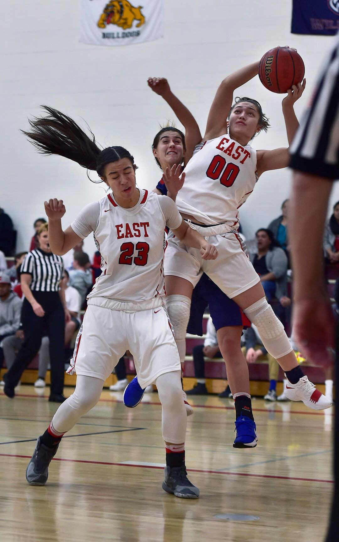 (Scott Sommerdorf   |  The Salt Lake Tribune)   East's Rae Falatea shoots during second half play, and injured a leg after she came down, missing most of he second half. East beat Woods Cross 50-36, Friday, December 15, 2017.  