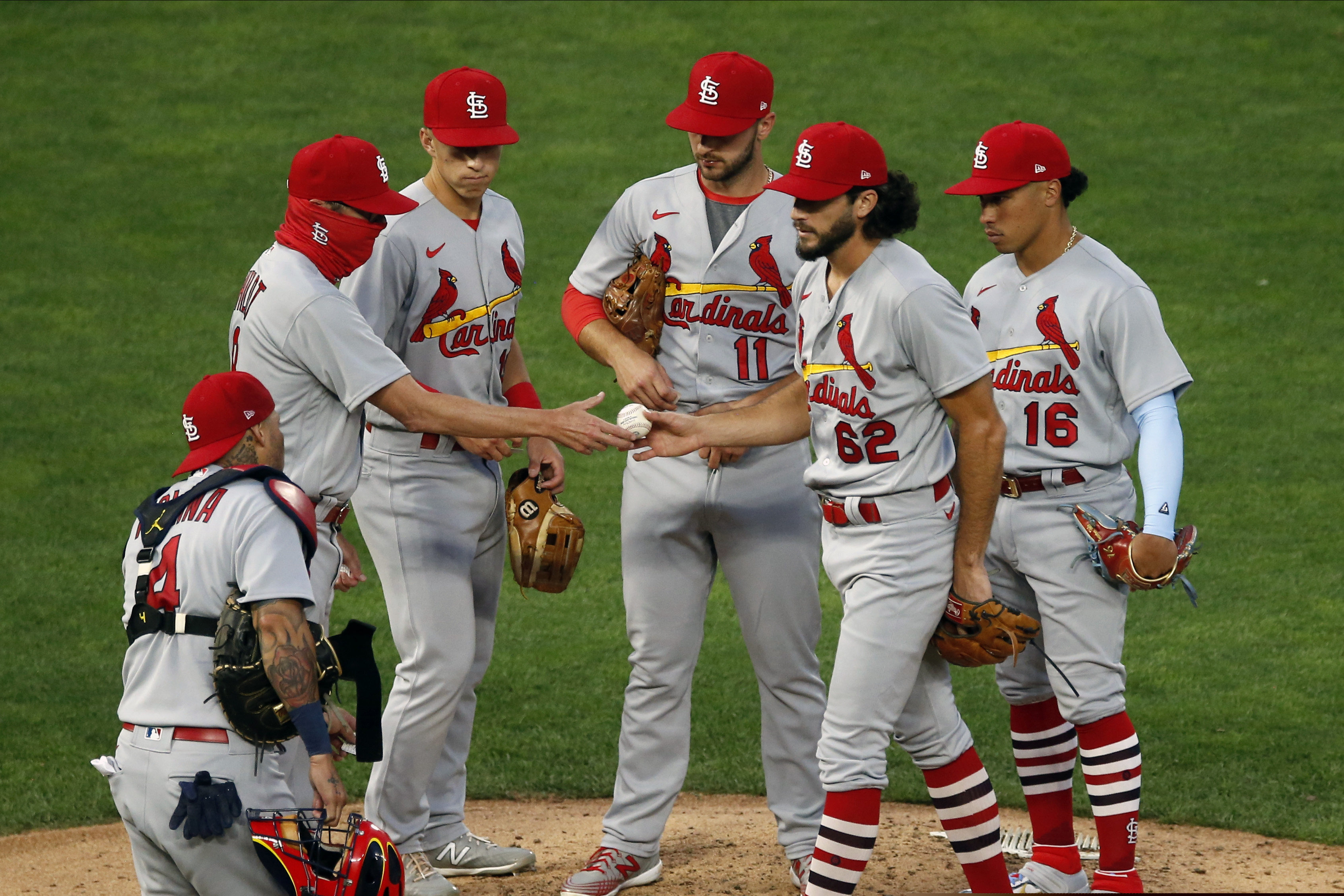(Jim Mone | AP) St. Louis Cardinals pitcher Daniel Ponce de Leon (62) hands the ball over to manager Mike Shildt, left, after being pulled in the fifth inning of the team's baseball game against the Minnesota Twins on Wednesday, July 29, 2020, in Minneapolis.