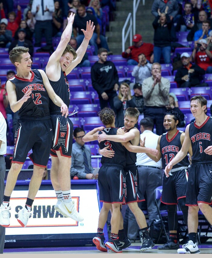 (Leah Hogsten  |  The Salt Lake Tribune) Weber's Trey Worrell (14) and Weber's Brandon Capener (22) celebrate the win. Weber defeated Kearns 60-52 in the 6A High School Boys' Basketball Tournament opening game at Weber State University’s Dee Events Center in Ogden, Tuesday, Feb. 27, 2018. 