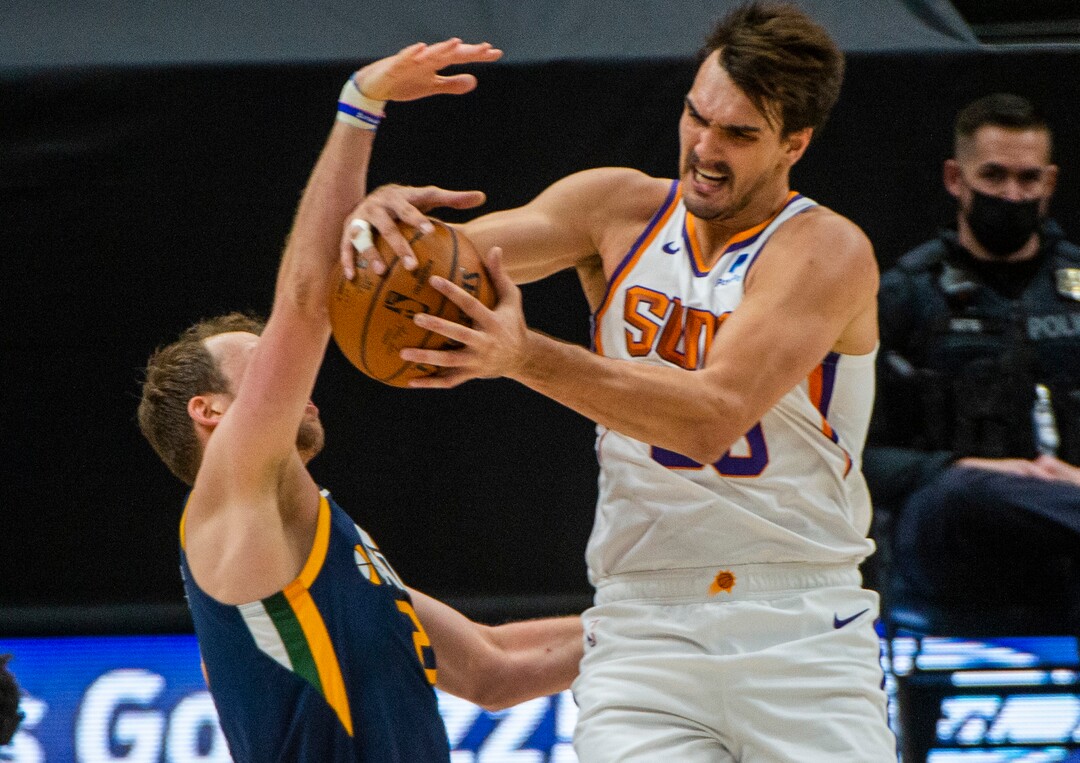 (Rick Egan | The Salt Lake Tribune) Phoenix Suns forward Dario Saric (20) is fouled by Utah Jazz forward Joe Ingles (2), in NBA action between the Utah Jazz and the Phoenix Suns, on Thursday, Dec. 31, 2020.