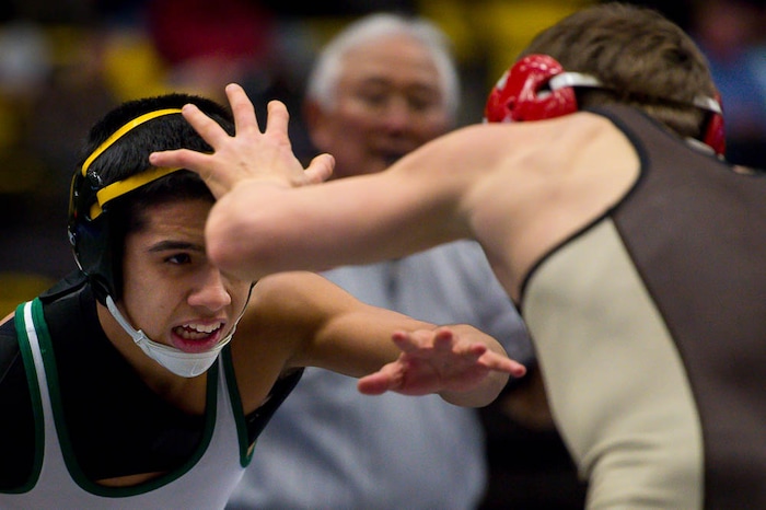 (Trent Nelson | The Salt Lake Tribune)  Davis's Parker Coffey (right) and Kearns's Antonio Aviles, 6A State Championships, high school wrestling quarterfinals in Orem, Wednesday February 7, 2018.