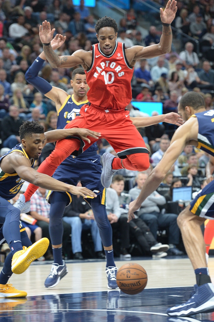 (Leah Hogsten  |  The Salt Lake Tribune) Utah Jazz guard Donovan Mitchell (45) and Utah Jazz center Rudy Gobert (27) try to grab the ball stripped from Toronto Raptors guard DeMar DeRozan (10). The Utah Jazz were defeated by the Toronto Raptors 100-109 at Vivint Smart Home Arena, Friday, November 3, 2017
