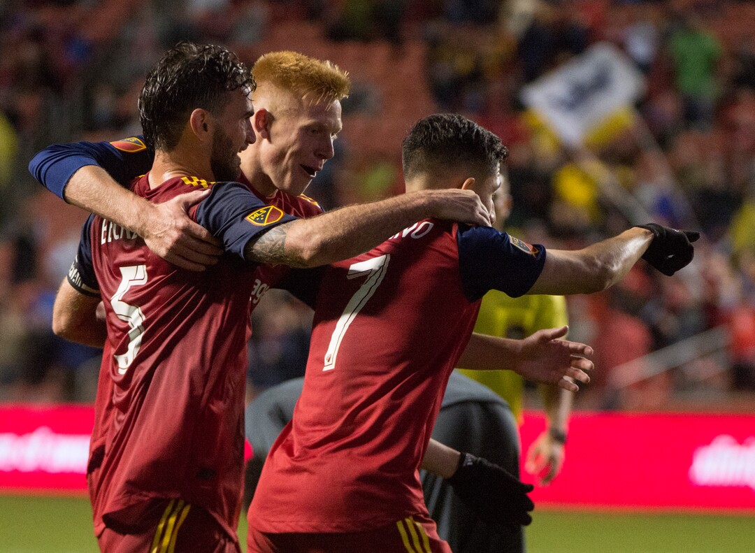 (Rick Egan  |  The Salt Lake Tribune)      Real Salt Lake defender Justen Glad (15) and Real Salt Lake midfielder Kyle Beckerman (5) celebrate as Real Salt Lake forward Jefferson Savarino (7) scores a goal in the second period, in MLS action between Real Salt Lake and Vancouver Whitecaps, at Rio Tinto Stadium beSaturday, April 7, 2018.
