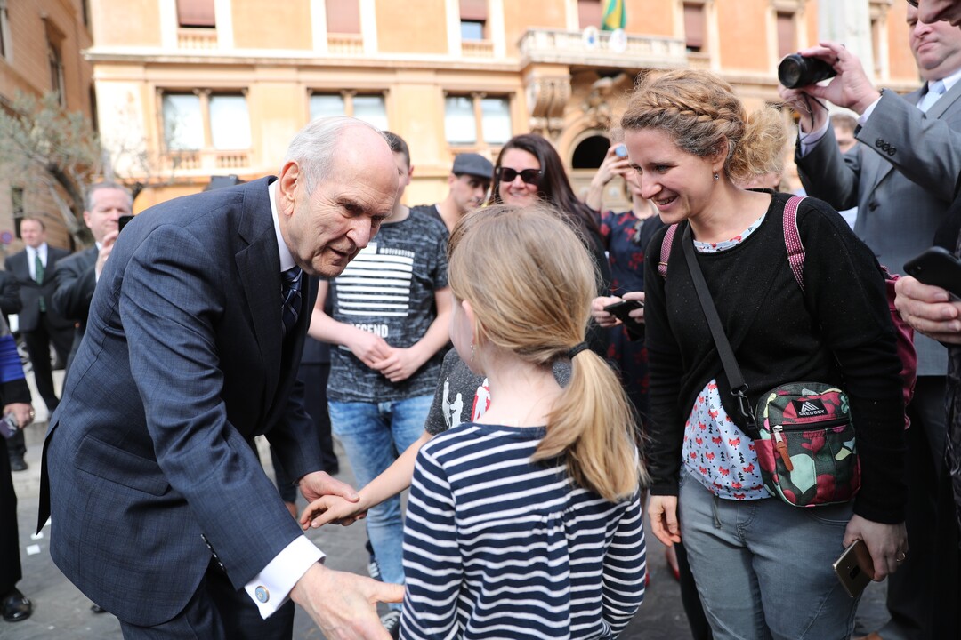 (Photo courtesy of The Church of Jesus Christ of Latter-day Saints) 
President Russell M. Nelson greets Latter-day Saints from Switzerland on the street leading to the Vatican in Rome. President Nelson met with Pope Francis on Saturday, March 9, 2019. The family came to Rome to participate in the dedication of the first temple in Italy.