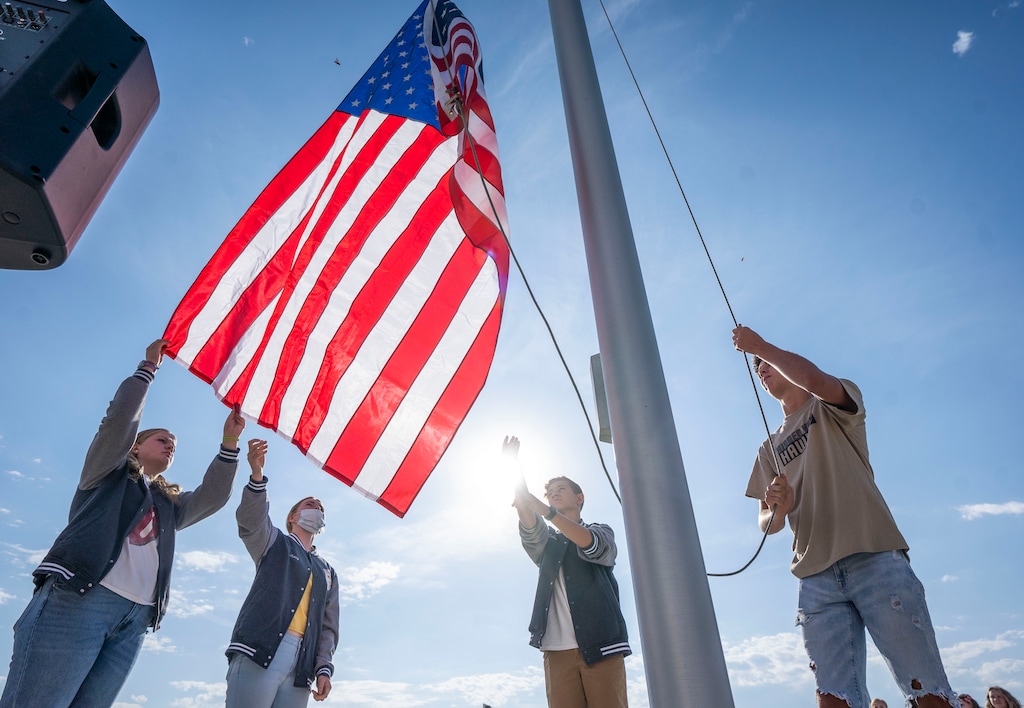 (Rick Egan | The Salt Lake Tribune) The Student Body officers at Hidden Valley Middle School raise the flag during a Sunrise Salute to Patriot's Day, in Bluffdale on Friday, Sept. 10, 2021.