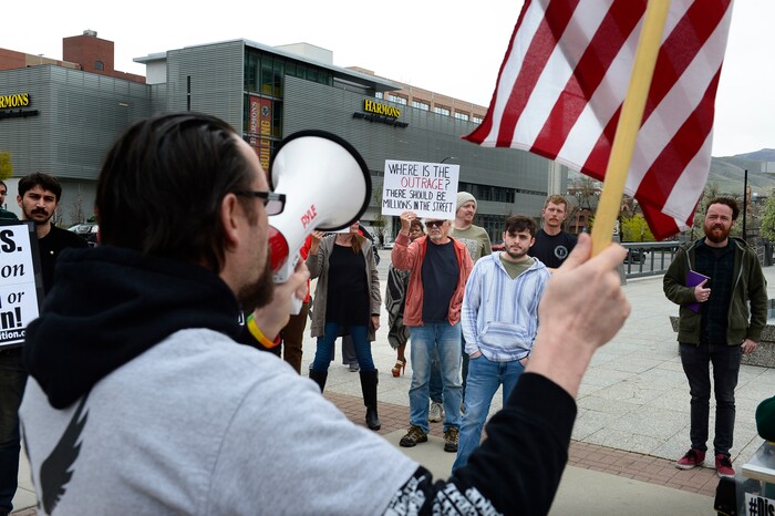(Scott Sommerdorf | The Salt Lake Tribune)
Josh Cameron speaks on the bullhorn as a group of about 40 people protested the strikes on Syria, Sunday, April 15, 2018.