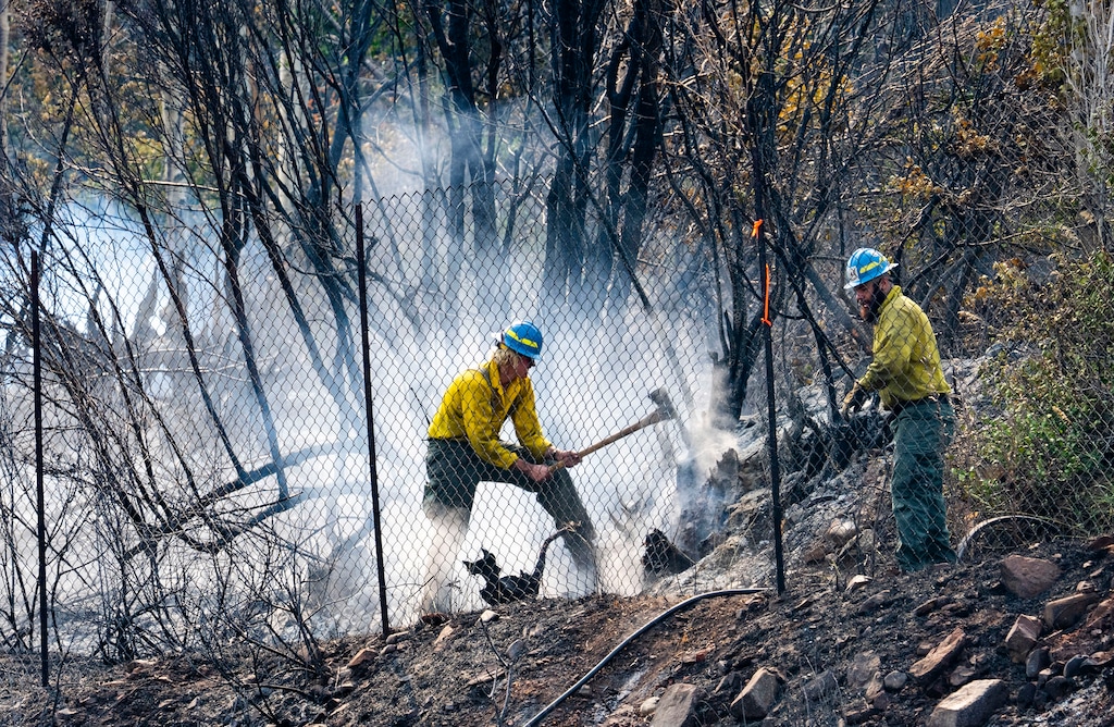 (Rick Egan | The Salt Lake Tribune) Firefighters work on some hot spots on the fire in Parleys Canyon, on Sunday, Aug. 15, 2021.