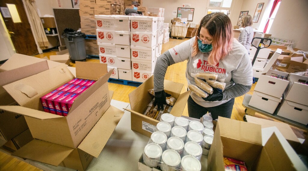 (Photo courtesy of The Church of Jesus Christ of Latter-day Saints) A volunteer helps pack food for people in need at the Salvation Army in Salt Lake City on Tuesday, Dec. 15, 2020. The Utah-based church has partnered with the Salvation Army since 1988. Over those 32 years, the church has made some 350 cash or commodity donations to various Salvation Army locations across the United States