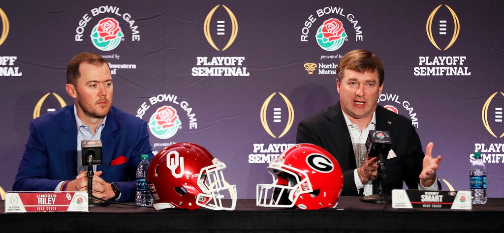 Georgia head coach Kirby Smart, right, speaks as Oklahoma head coach Lincoln Riley listens during an NCAA college football news conference, Sunday, Dec. 31, 2017, in Los Angeles. Oklahoma and Georgia meet at the Rose Bowl in a College Football Playoff semifinal on New Year's Day. (Bob Andres/Atlanta Journal-Constitution via AP)