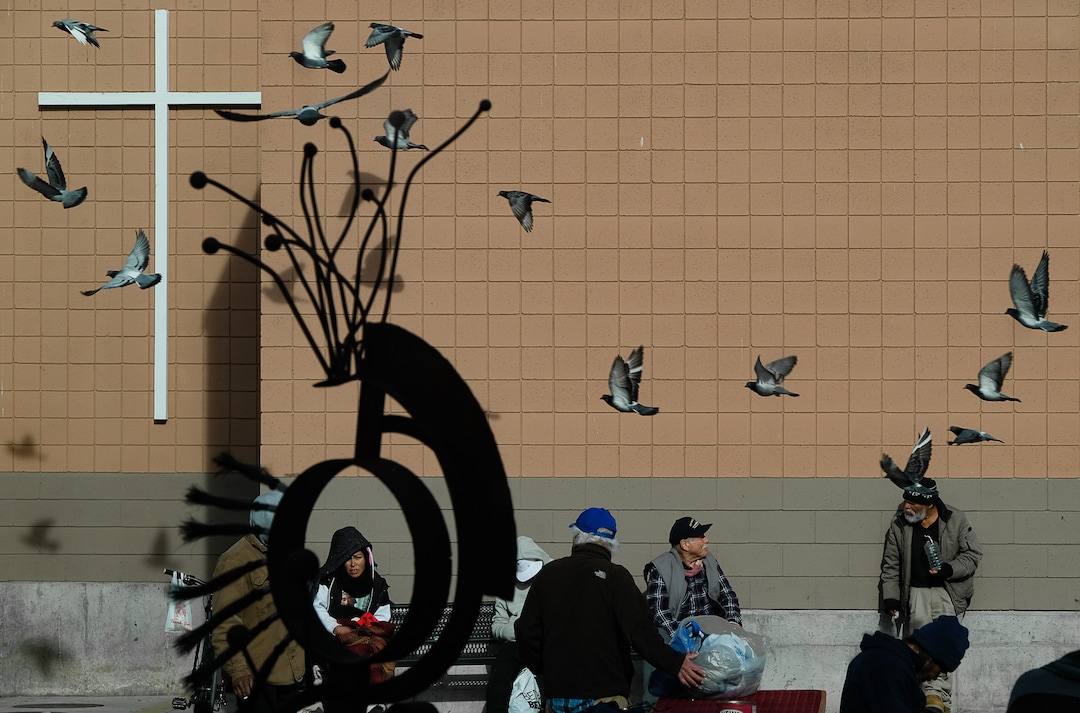 (Francisco Kjolseth  |  The Salt Lake Tribune) People spend time in the courtyard of the Weigand Center in downtown Salt Lake City, as they wait for lunch services on Wednesday, Dec. 18, 2019. The American Civil Liberties Union recommends policy decisions come with considerable input from people experiencing homelessness, who are best positioned to offer a sense of how the community will be affected. Catholic Community Services is one organization that is seeking that input, through surveys at kiosks created by Pulse for Good, a Utah-based company, at the Weigand Center and its new homeless resource center in Salt Lake City. The surveys ask about service, cleanliness and what people would like to see at its locations.