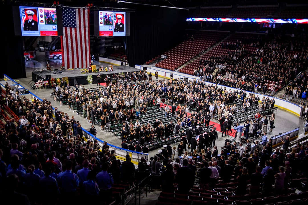 (Trent Nelson | The Salt Lake Tribune)  Funeral services for Battalion Chief Matthew Burchett at the Maverik Center in West Valley City, Monday Aug. 20, 2018.