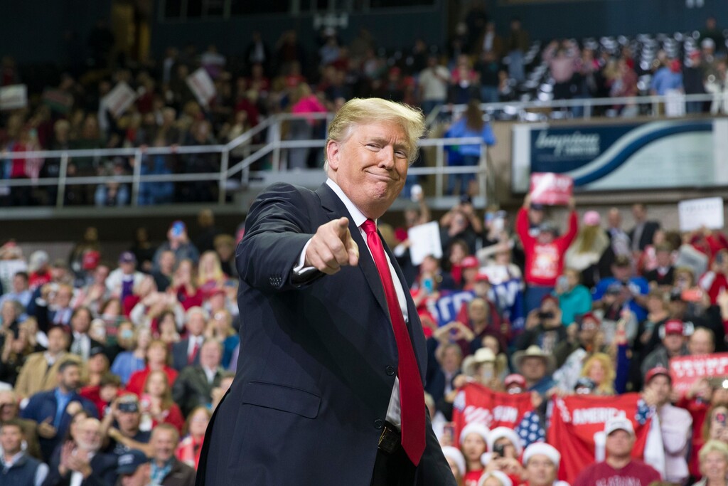 FILE - In this Nov. 26, 2018, file photo, President Donald Trump points to a supporter as he departs a rally at the Mississippi Coast Coliseum in Biloxi, Miss. President Donald Trump’s campaign has launched a state-by-state effort to prevent an intraparty fight that could spill over into the general-election campaign. The initiative includes changing state party rules, crowding out potential rivals and quelling any early signs of opposition. (AP Photo/Alex Brandon, File)