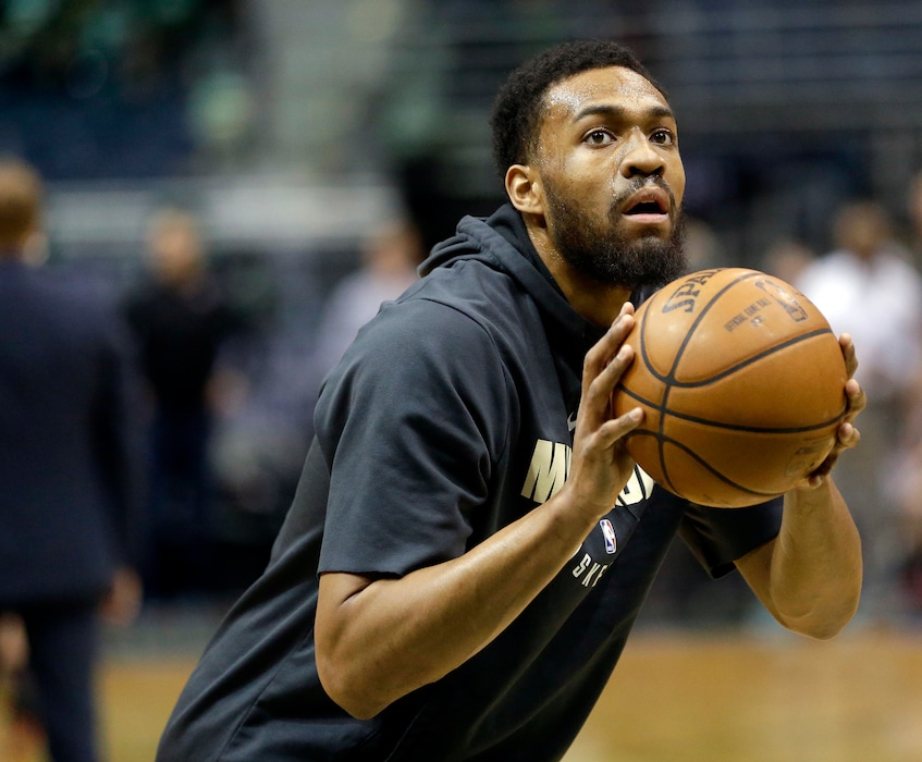 FILE - In this Wednesday, Jan. 17, 2018, file photo, Milwaukee Bucks' Jabari Parker shoots before an NBA basketball game against the Miami Heat in Milwaukee. Parker hopes to be back in a couple weeks, and he says he’ll keep talking with the Bucks’ medical staff about the timeline that was initially set by former coach Jason Kidd. Kidd was fired this week, meaning that Parker is part of a team that has changed coaches for the first time in his career going back to his one college season at Duke. (AP Photo/Aaron Gash, File)