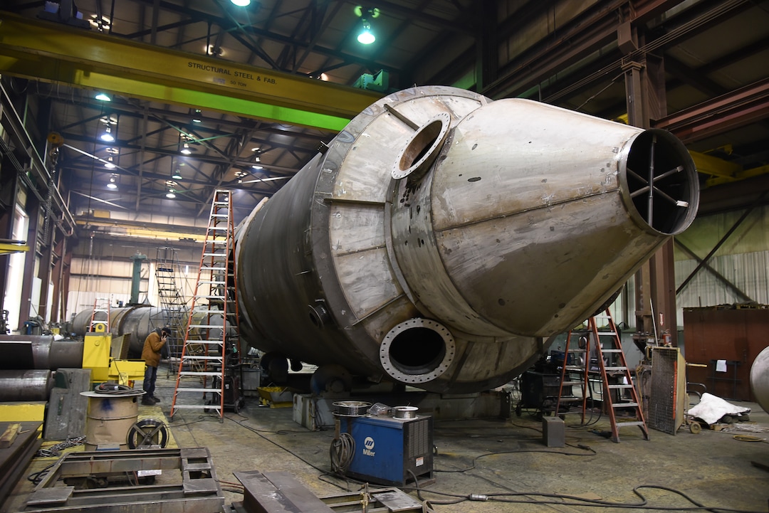 (Francisco Kjolseth  |  The Salt Lake Tribune)  Crews work on a large drying tower bound for a gold mine in Nevada at Structural Steel and Plate Fabrication in North Salt Lake on Friday, Dec. 28, 2018. Recent metal tariffs implemented by the Trump administration though a boom for steel producers has negatively impacted metal fabrication businesses creating numerous challenges. 