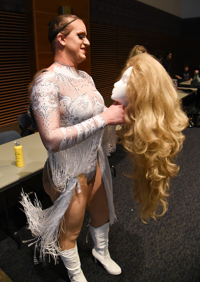 (Francisco Kjolseth  |  The Salt Lake Tribune)  Kyel Beardall, prepares his wig as he takes on the persona of Emerald Fantom Daa for Utah State University's first drag show recently. 