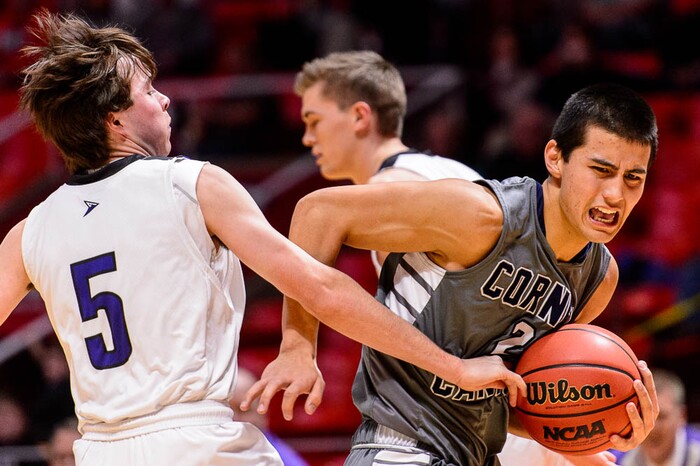 (Trent Nelson | The Salt Lake Tribune)  Box Elder vs. Corner Canyon, 5A State high school basketball tournament at the Huntsman Center in Salt Lake City, Wednesday Feb. 28, 2018. Corner Canyon's John Mitchell (2) drives past Box Elder's Cameron Saunders (5).