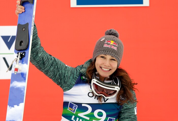 Sarah Hendrickson from the U.S. celebrates her third place at the Ski Jumping World Cup women's event in Ljubno, Slovenia, Saturday, Feb. 14, 2015. (AP Photo/Darko Bandic)