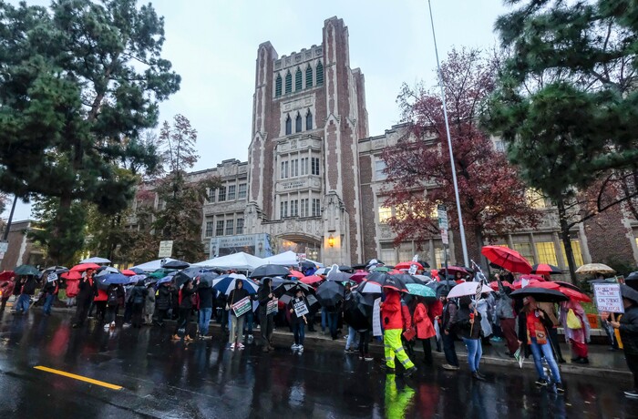 (Ringo H.W. Chiu | The Associated Press)  Teachers strike in the rain outside John Marshall High School, Monday, Jan. 14, 2019, in Los Angeles. Tens of thousands of Los Angeles teachers are striking after contentious contract negotiations failed in the nation's second-largest school district.