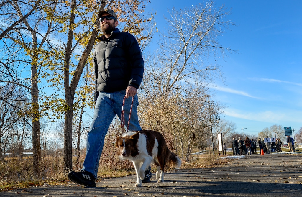 (Leah Hogsten | The Salt Lake Tribune) "I am super stoked about Tracy Aviary," said Bob Gray, who stopped to hear about the changes to Jordan River Park at a press conference before returning to a walk with his dog, Penny. Gray, who walks the river trail daily said "something like this has been needed" for the river corridor. The Jordan River Park will be expanding to prioritize preservation of natural habitat, more recreation opportunities and better accessibility under the newly proposed Tracy Aviary's Jordan River Nature Center, announced Monday, Nov. 26, 2018.